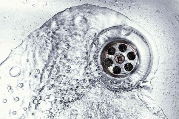Water softener installation technician working on a whole home system in San Diego, CA
