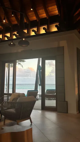 Ocean view from a lounge with open terrace doors
