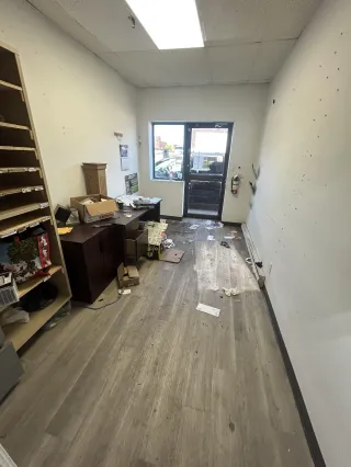 Cluttered office before a Junk Bandits cleanout