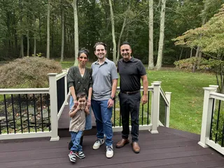 A family together on a home deck.