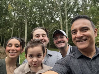 An outdoor family selfie.