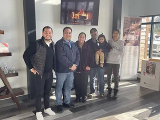 A group portrait in a bright office.
