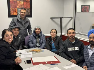 A group gathered around a meeting table.