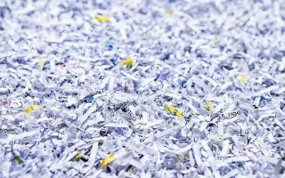 What happens to the shredded paper after it's collected?