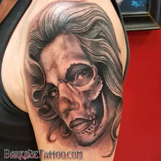 Black and Gray Skull Face Tattoo