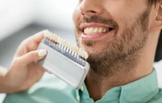 Should You Choose Porcelain Crowns or Veneers For Your Smile Makeover?