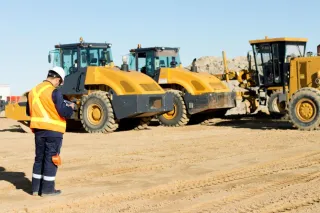 Why should site inspections include verifying equipment operator qualifications?