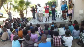 Angie with BOHA youth performing a drama at a community VBS 16 years ago.