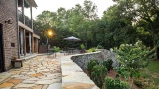 How To Add A Drain Behind Curve Retaining Wall?