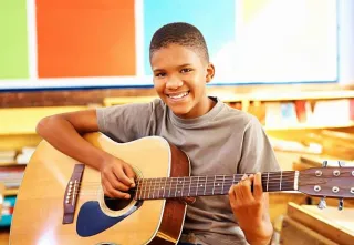 How to Choose the Right Guitar or Ukulele for Your Child: A Parent’s Guide