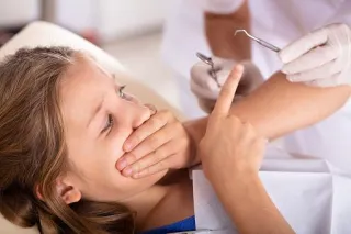 Overcoming Your Child's Fear Of The Dentist: Tips and Tricks For A Positive Experience.