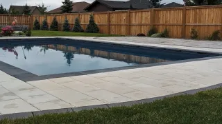What Are Some Considerations For Landscaping Around A Pool?