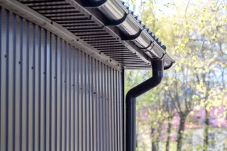 Preventing Water Damage: The Importance of Well-Maintained Gutters and Downspouts