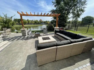 The Bold Impact of a Gas Fire Pit and Stone-Wrapped Pergola