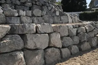 Retaining Walls 101: Stylish Solutions for Sloped Yards in Utah County