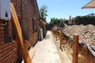 Retaining Walls and Rock Clauses: Why Digging Can Cost You (and Your Sanity)