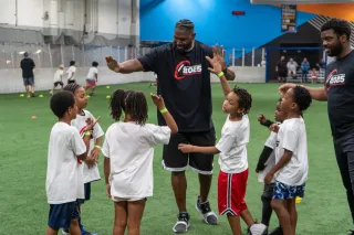With a Servant’s Heart: Empowering Youth at Our First Annual Football Camp!  