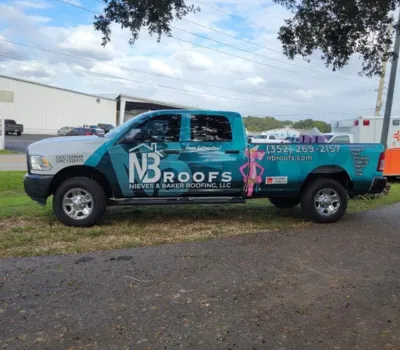 NB Roofs branded company pickup truck
