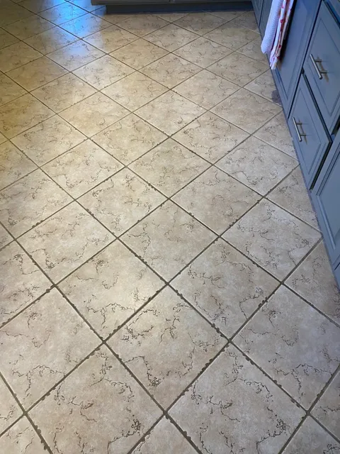 Kitchen diagonal tile and grout before professional cleaning and restoration in South Bay CA
