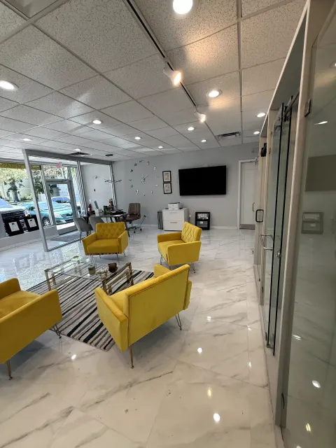 Showroom lounge area surrounded by glass door displays