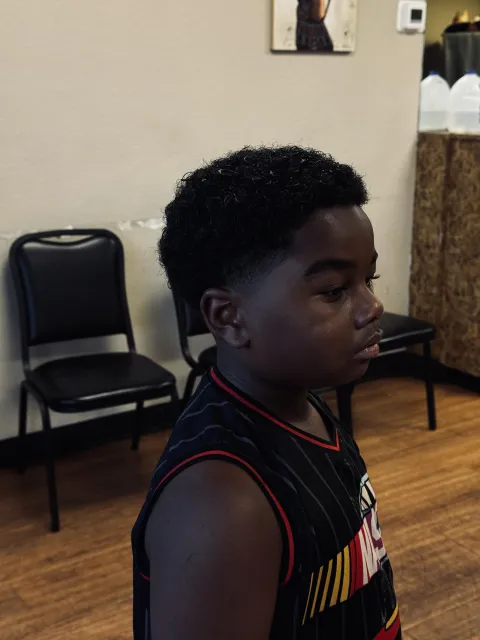 Young client after a fresh cut at the shop