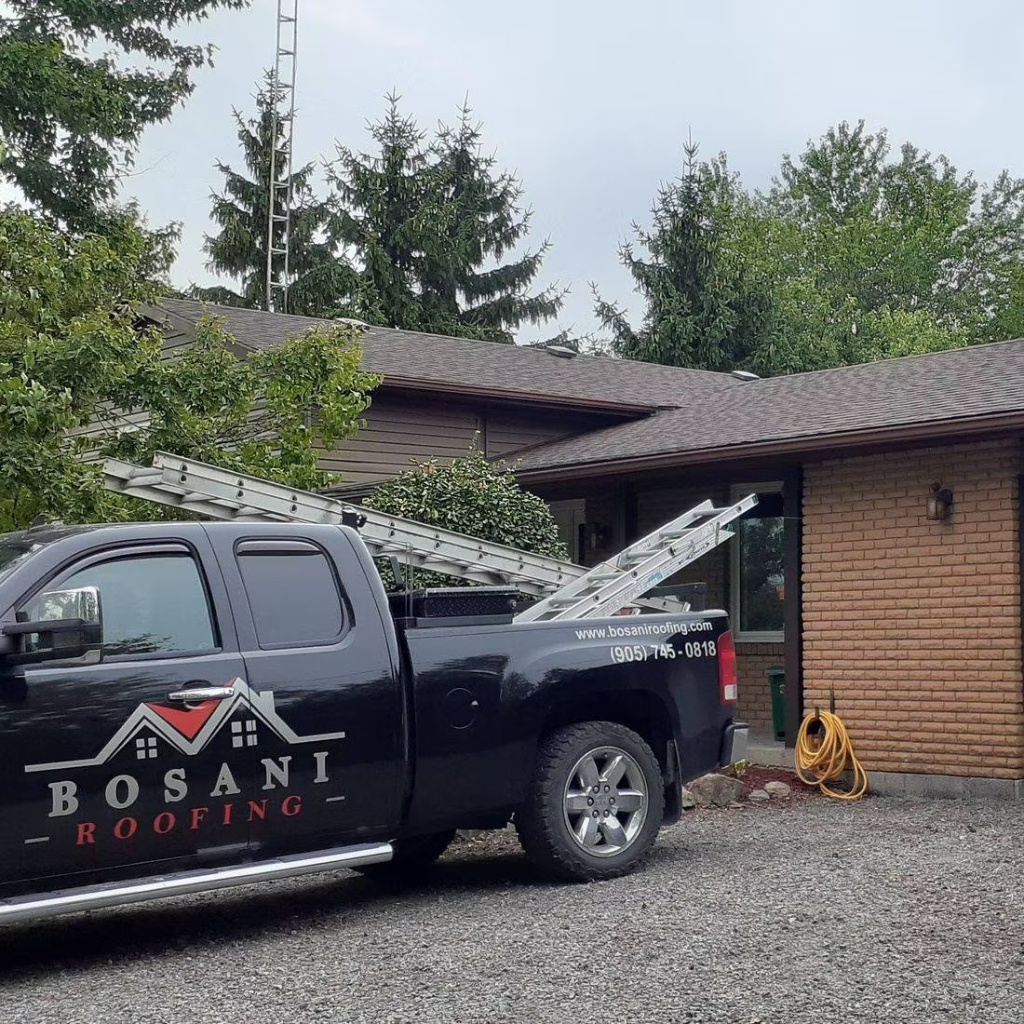 Bosani Roofing contractor truck with ladders at a Hamilton roofing project site