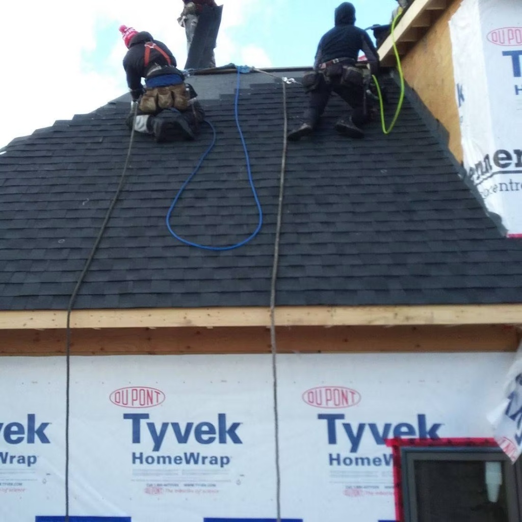 Professional roofing contractors from Bosani Roofing working on a Hamilton Ontario home