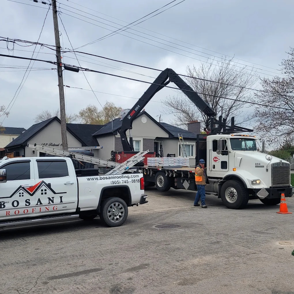 Bosani Roofing fleet vehicles and equipment for heavy roofing material delivery in Hamilton