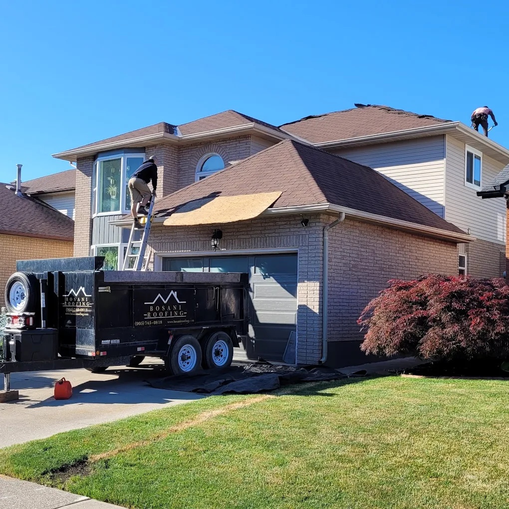 Bosani Roofing crew wearing safety harnesses during a residential roof installation in Hamilton