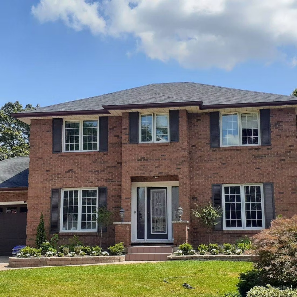 Completed asphalt shingle roof replacement by Bosani Roofing on a Hamilton home