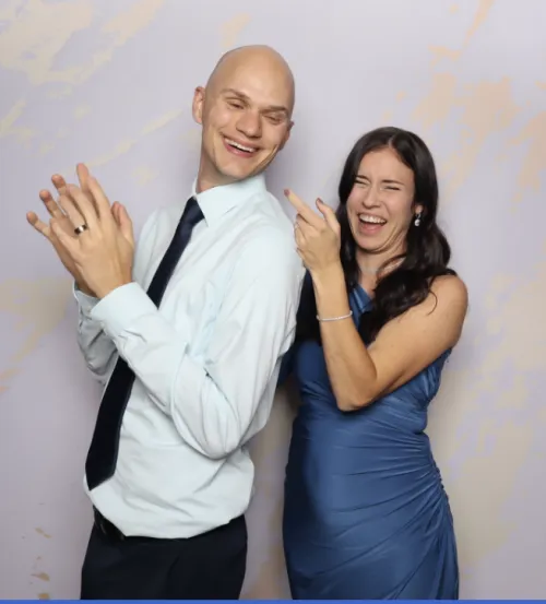 Happy couple laughing together at a Photo-N-Go experience