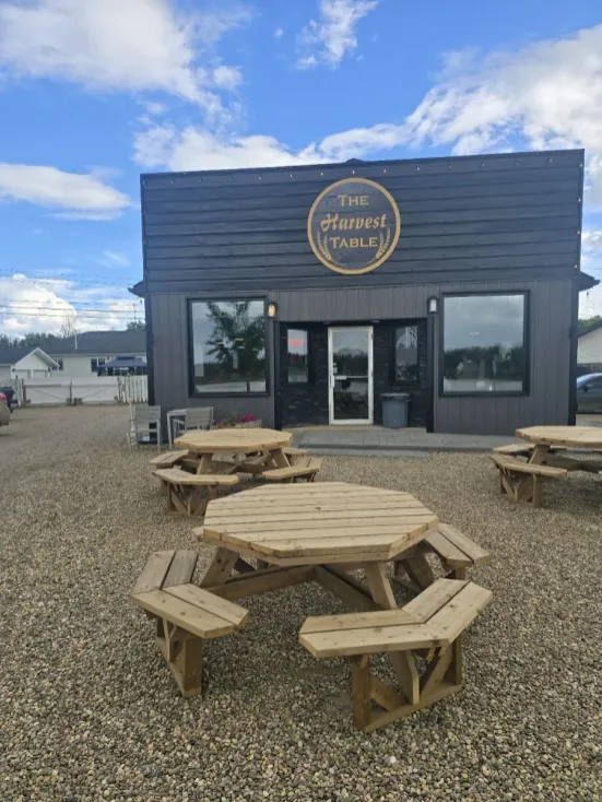 The Harvest Table storefront and outdoor seating on River Road in Fort Vermilion