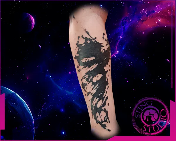 Black ink splash tattoo by Derrick at Sting Studio Ottawa
