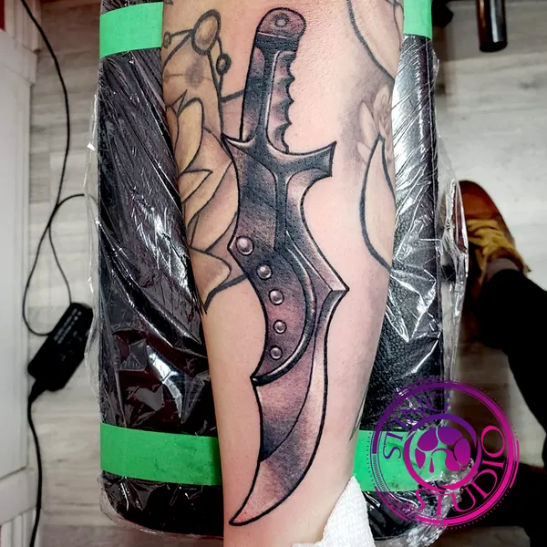 Dagger tattoo by Derrick at Sting Studio Ottawa
