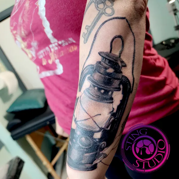Lantern tattoo by Derrick at Sting Studio Ottawa