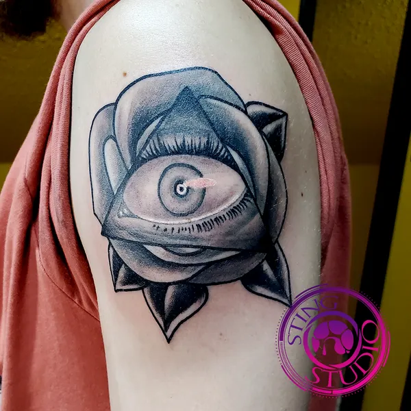 Rose triangle eye tattoo by Derrick at Sting Studio Ottawa