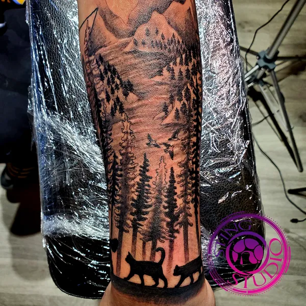 Cat silhouette landscape tattoo by Derrick at Sting Studio Ottawa