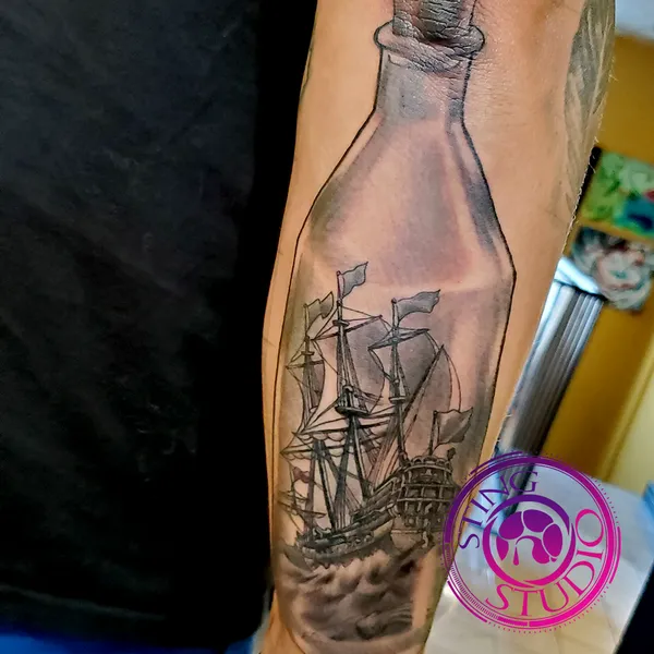 Bottled ship tattoo by Derrick at Sting Studio Ottawa
