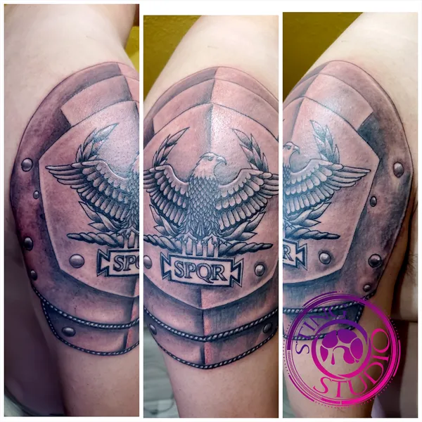Shoulder armor tattoo by Derrick at Sting Studio Ottawa