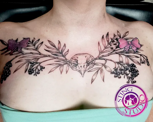 Mulberry branches and robin skull tattoo by Derrick at Sting Studio Ottawa