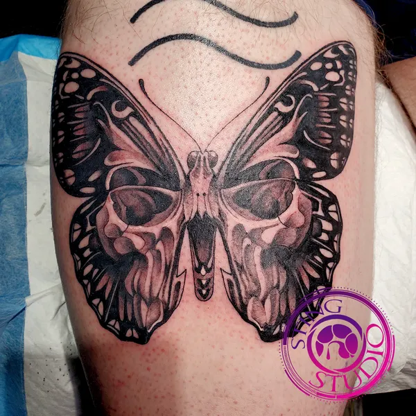 Skull butterfly tattoo by Derrick at Sting Studio Ottawa