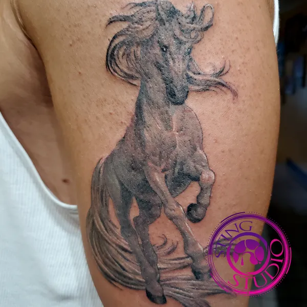 Elegant horse tattoo by Derrick at Sting Studio Ottawa