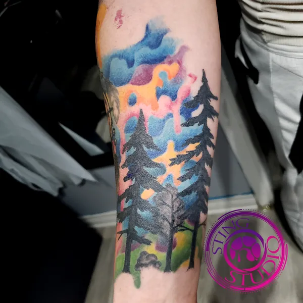 Watercolor pine trees tattoo by Derrick at Sting Studio Ottawa