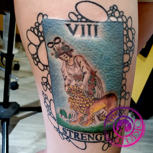 Tarot card strength tattoo by Derrick at Sting Studio Ottawa