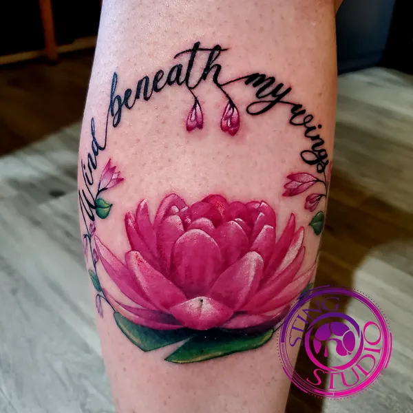 Pink lotus calf tattoo by Derrick at Sting Studio Ottawa