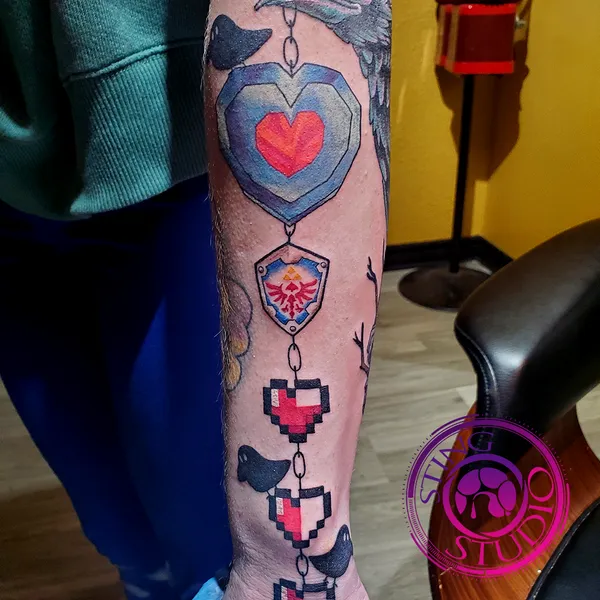 Zelda hearts hyrule shield tattoo by Derrick at Sting Studio Ottawa