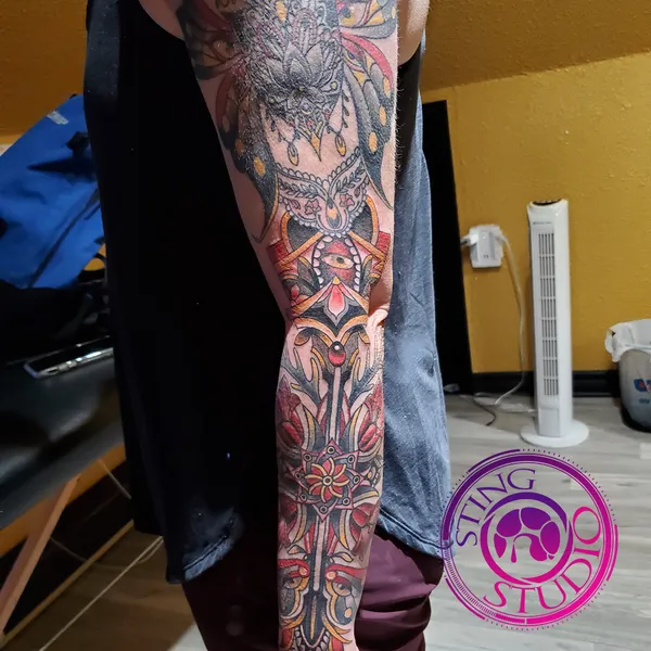 Ornamental abstract bold sleeve tattoo by Derrick at Sting Studio Ottawa