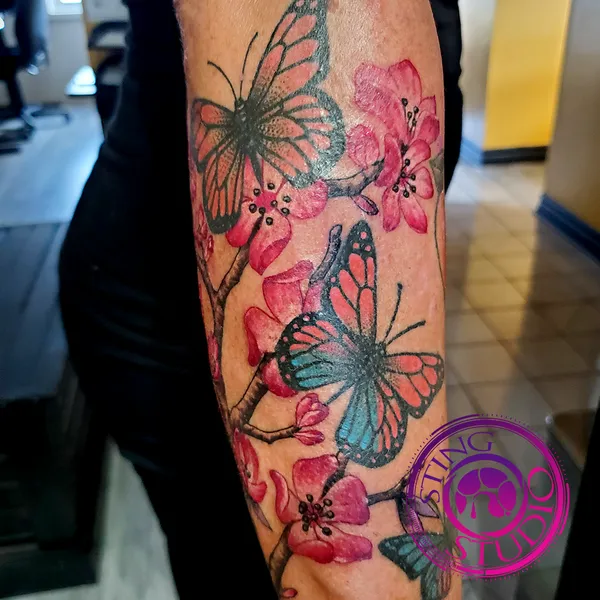 Cherry blossoms butterflies tattoo by Derrick at Sting Studio Ottawa