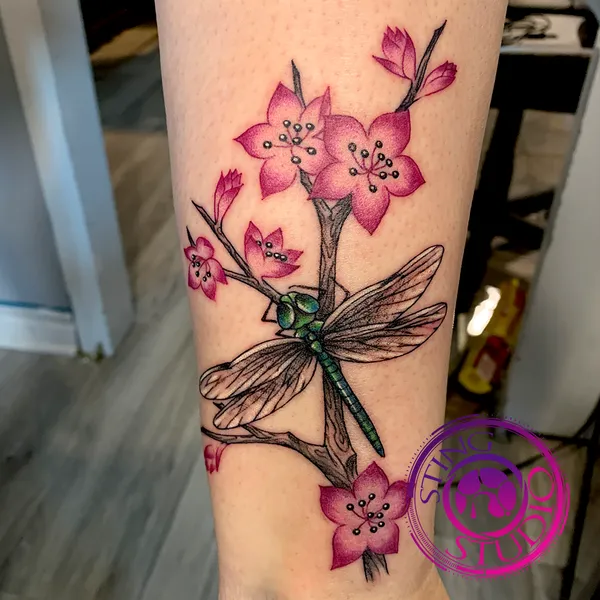 Cherry blossom dragonfly tattoo by Derrick at Sting Studio Ottawa