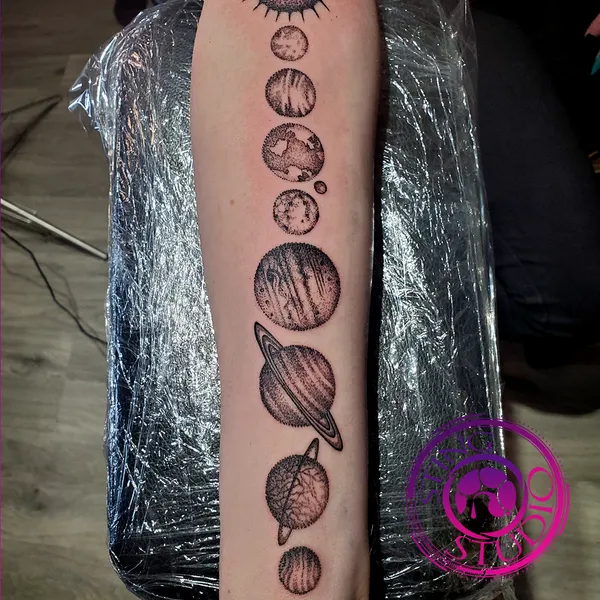 Solar system tattoo by Derrick at Sting Studio Ottawa
